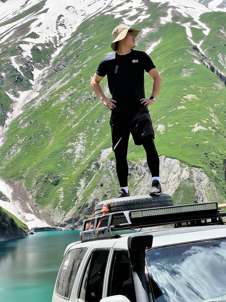 Omurbek Azhibaev, founder of KÖCH, standing at a yurt camp in Kyrgyzstan